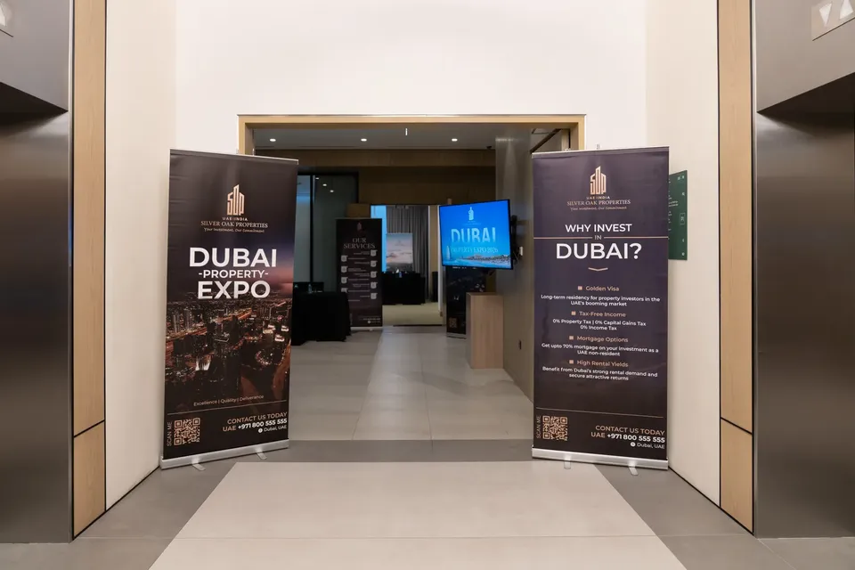 Two Silver Oak Properties banners flank a doorway into the expo hall, one headed Why invest in Dubai?